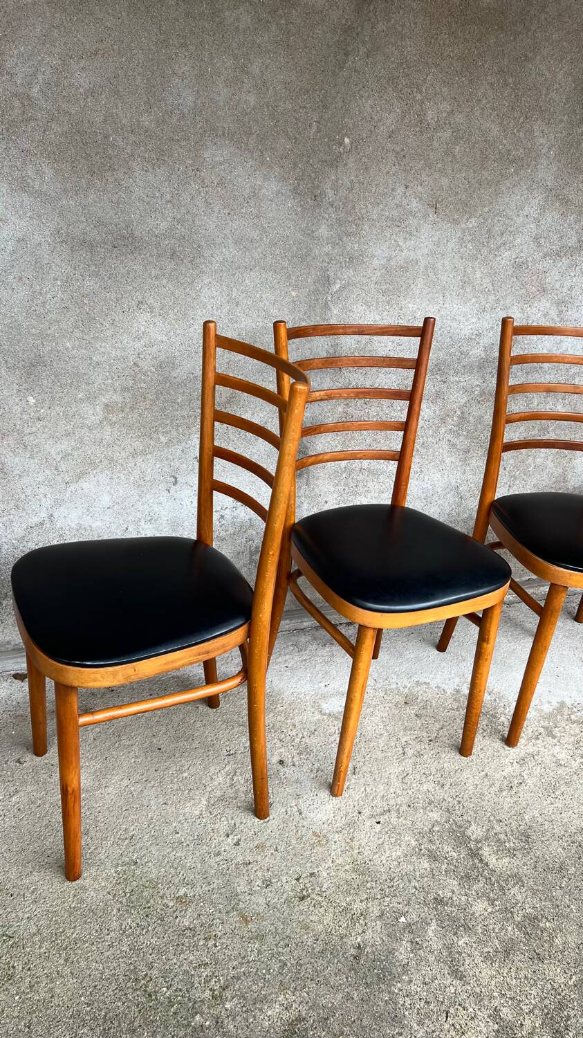 Set of 4 vintage wooden chairs with faux leather.