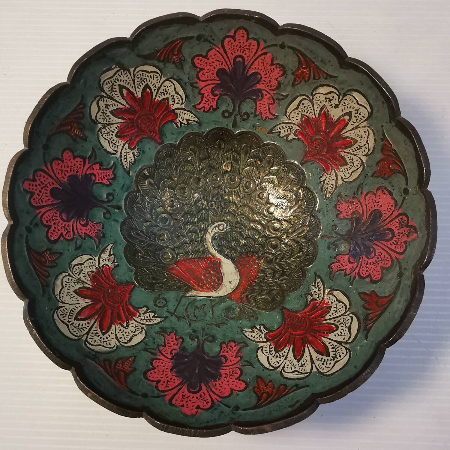 Old Indian brass bowl with peacock decoration