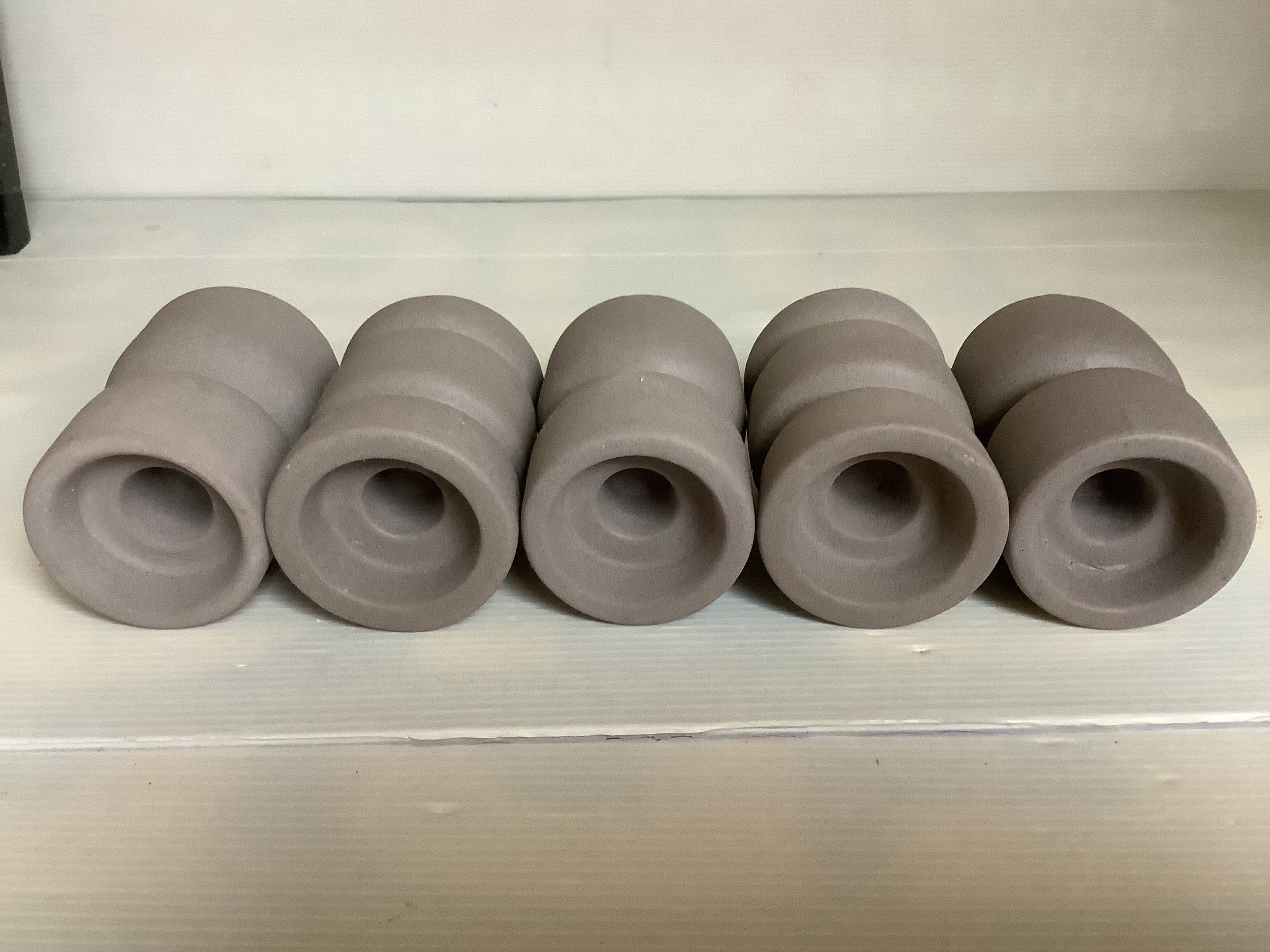 Five matte gray candle holders
