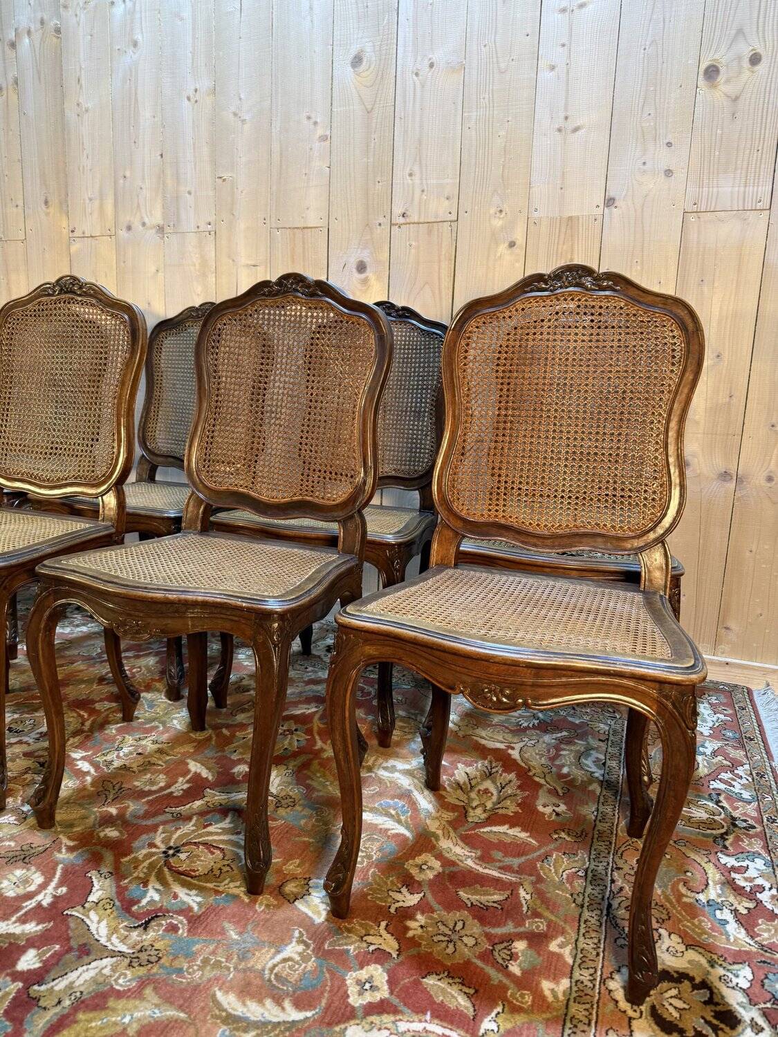 Set of 10 Louis XV style chairs in walnut and cane.