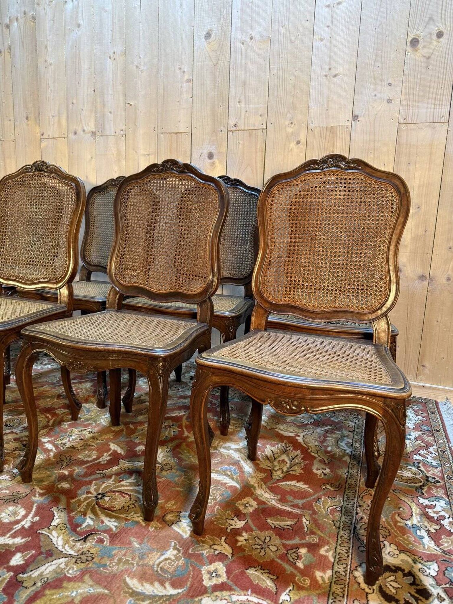 Set of 10 Louis XV style chairs in walnut and cane.
