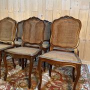 Set of 10 Louis XV style chairs in walnut and cane.