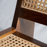 Reclined armchair in canned teak in natural wood