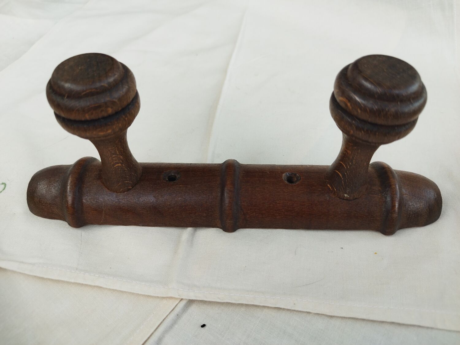 Wooden coat rack turned two hooks