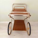 Rolling trolley in gold metal