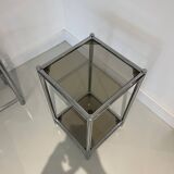 Bolster or end table in chrome steel with smoked window.