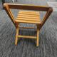 Children's folding chair made of wood.