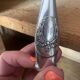 Silver metal sugar tongs from the Gombault house for tea time.