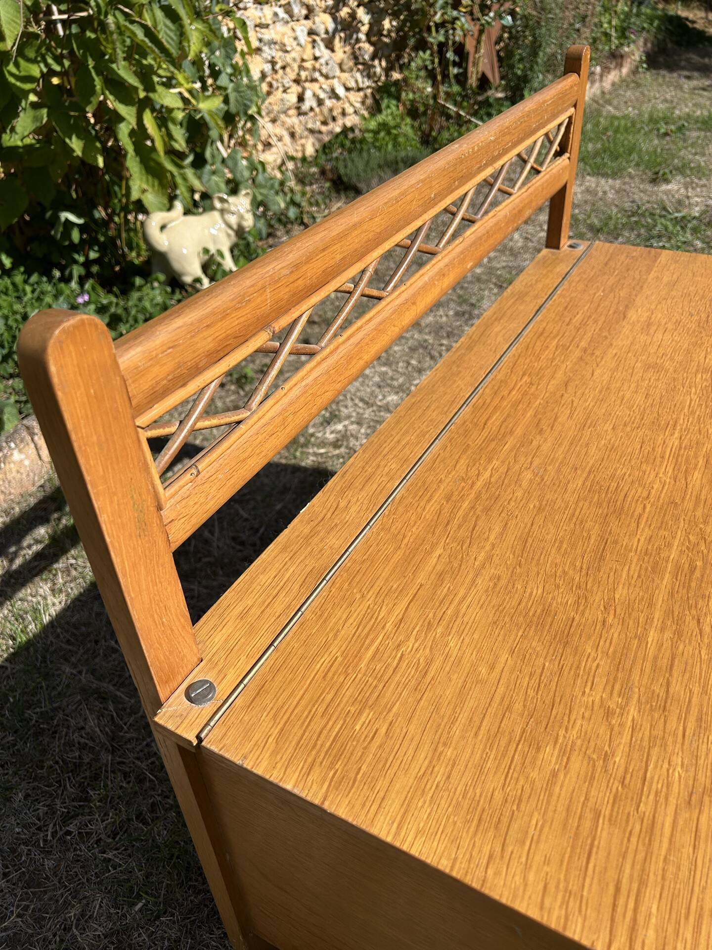 Vintage 1960s bank chest in light oak and rattan weaving.