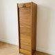 Antique oak filing cabinet with curtains