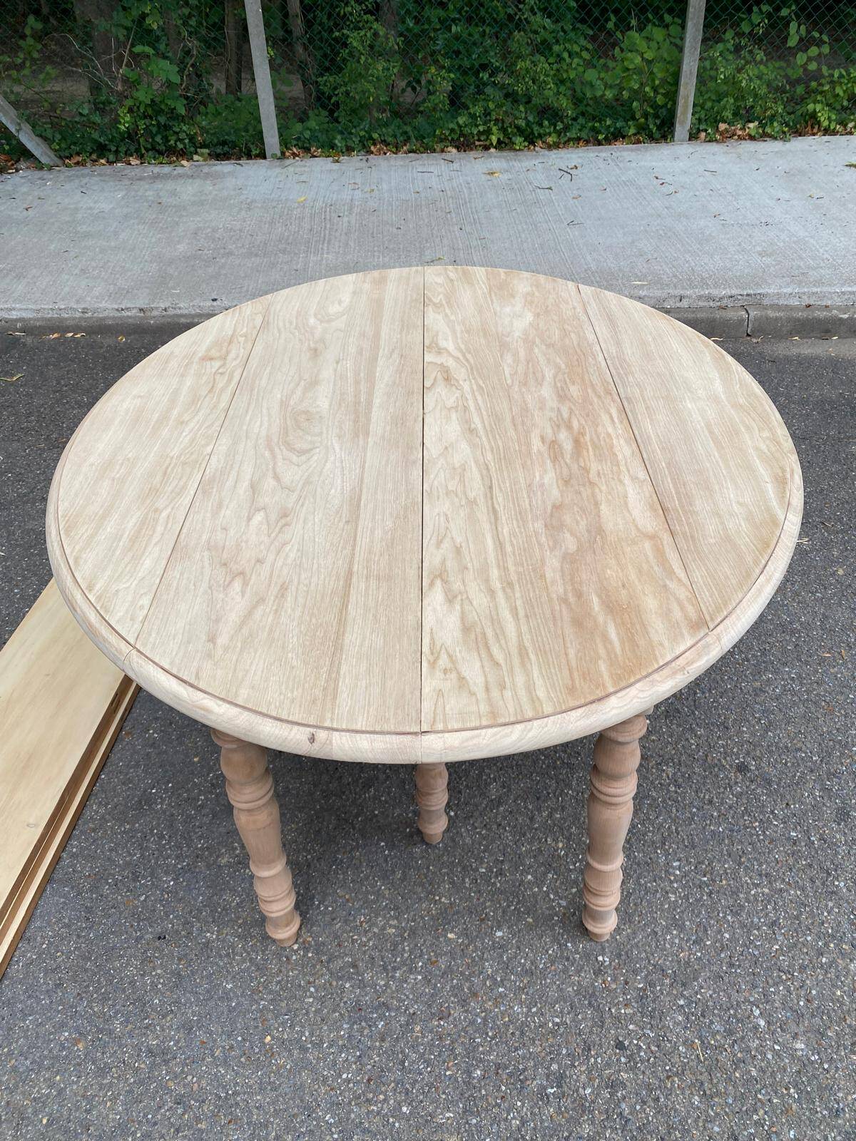 Renovated Louis Philippe round extendable dining table with flaps and 3 extensions.