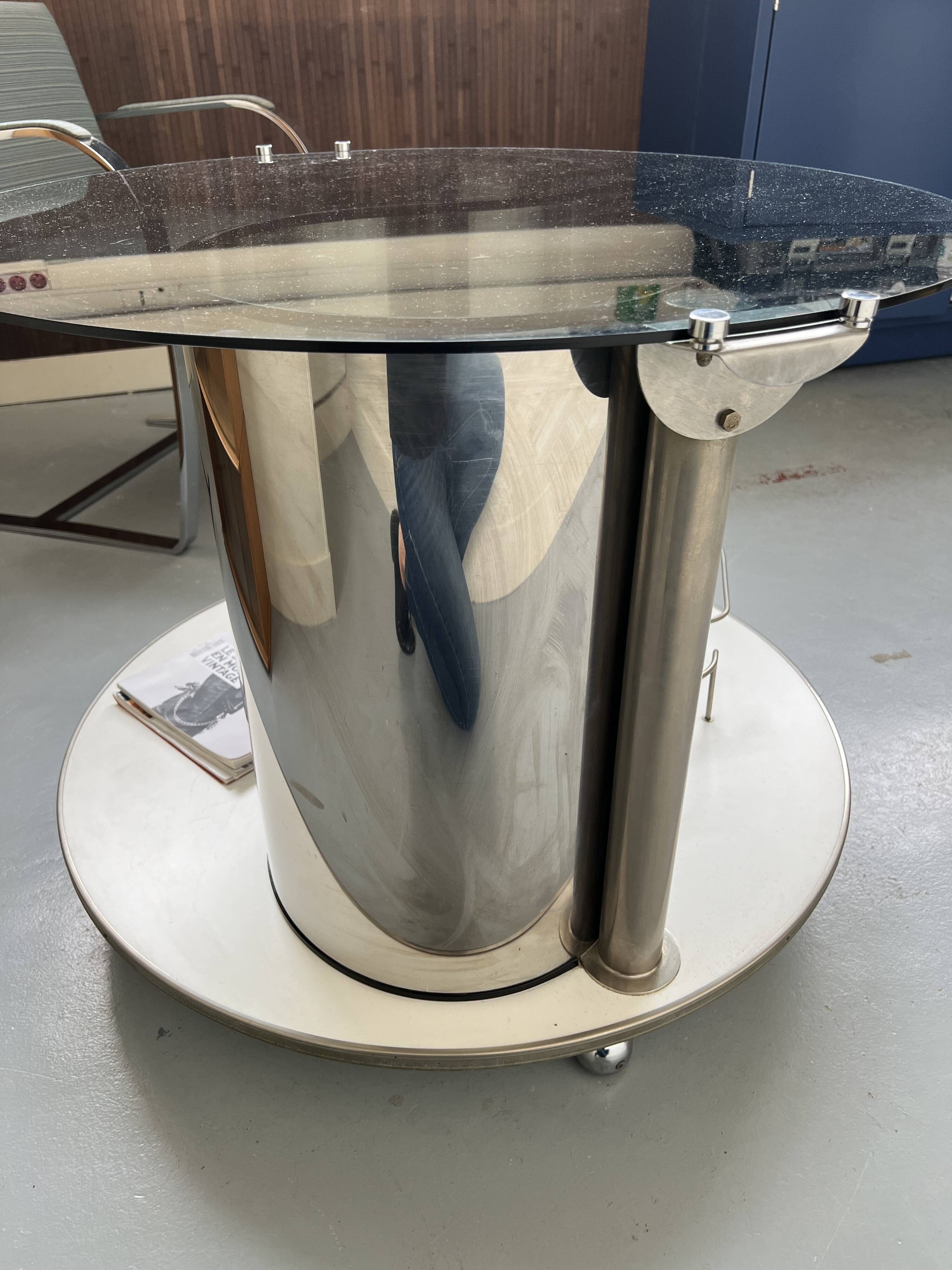 Vintage metal and smoked glass coffee table on casters bar