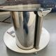 Vintage metal and smoked glass coffee table on casters bar