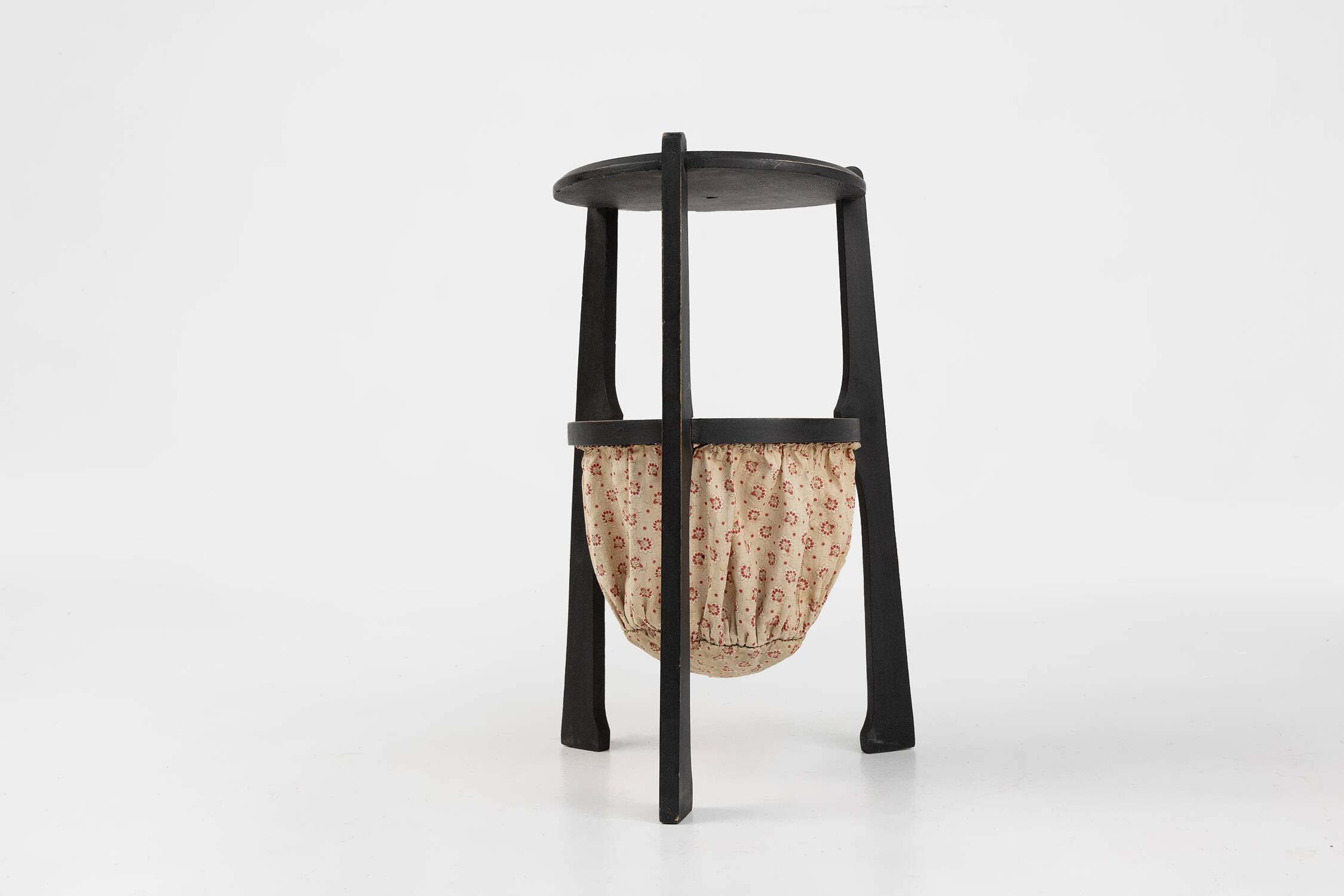 Art Nouveau side table in blackened wood with storage basket, Belgium ca. 1910