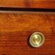 Antique chest of drawers with cross motifs, made entirely of solid walnut.