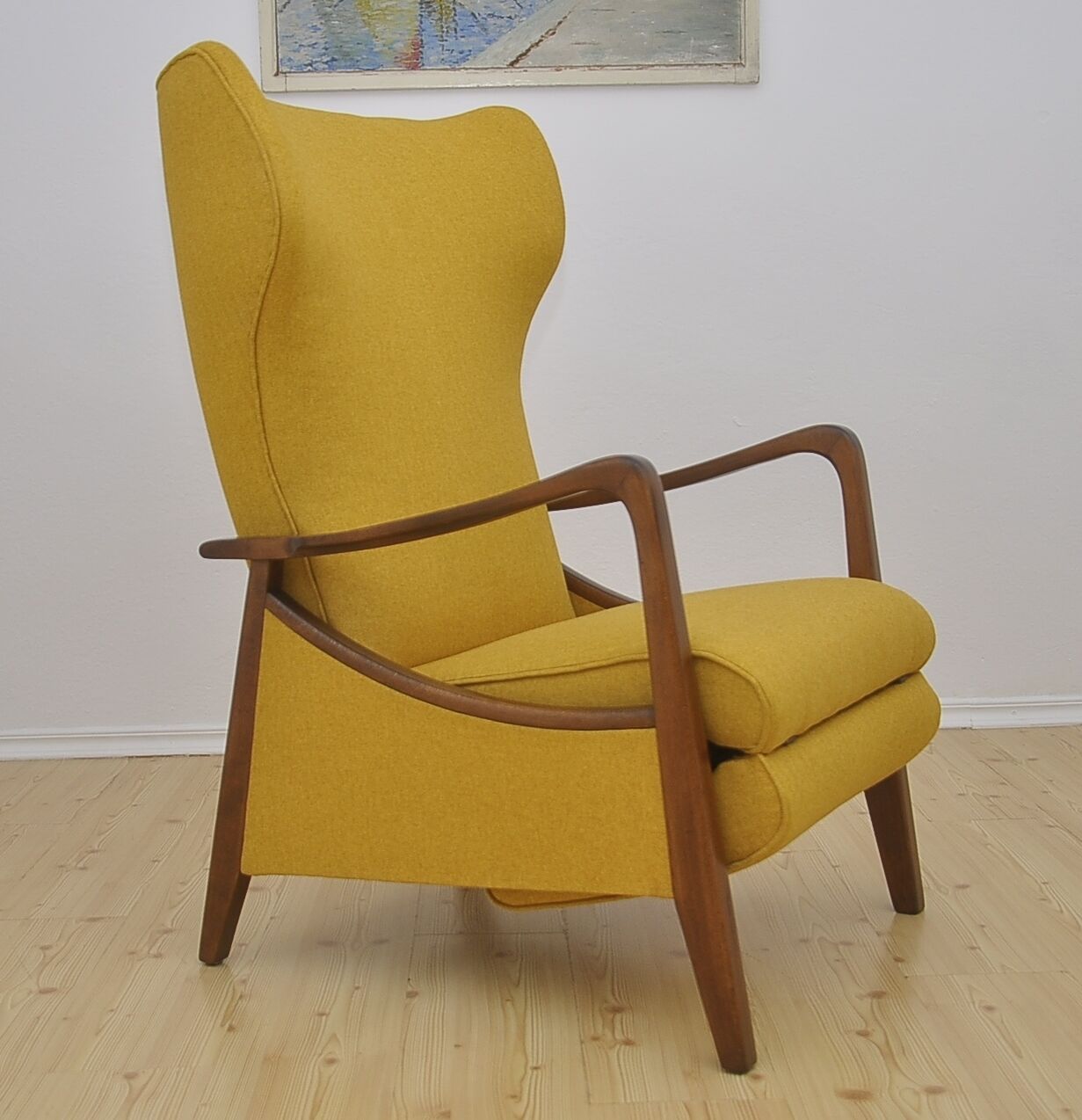 Mid-century Wingback armchair with folding footrest, 1960s