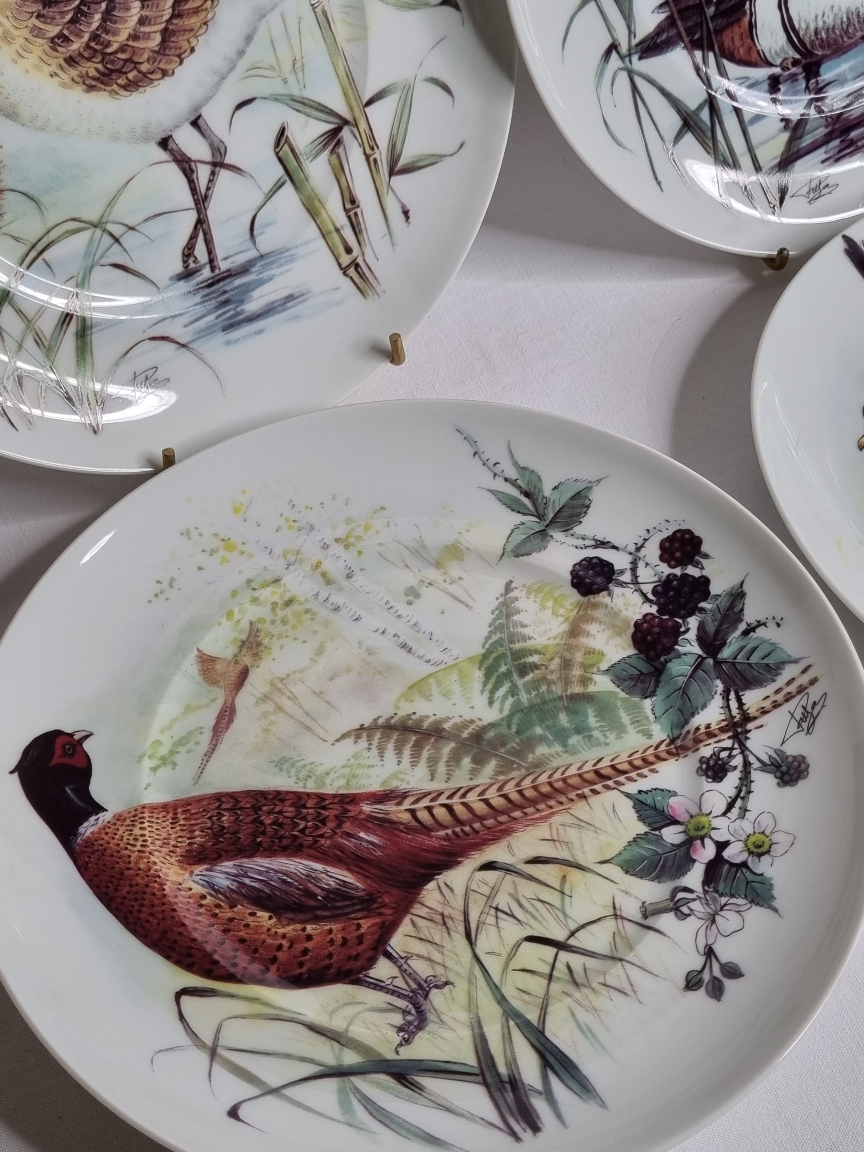 Set of six porcelain plates decorated with birds from Sologne, Limoges, signed, 25 cm