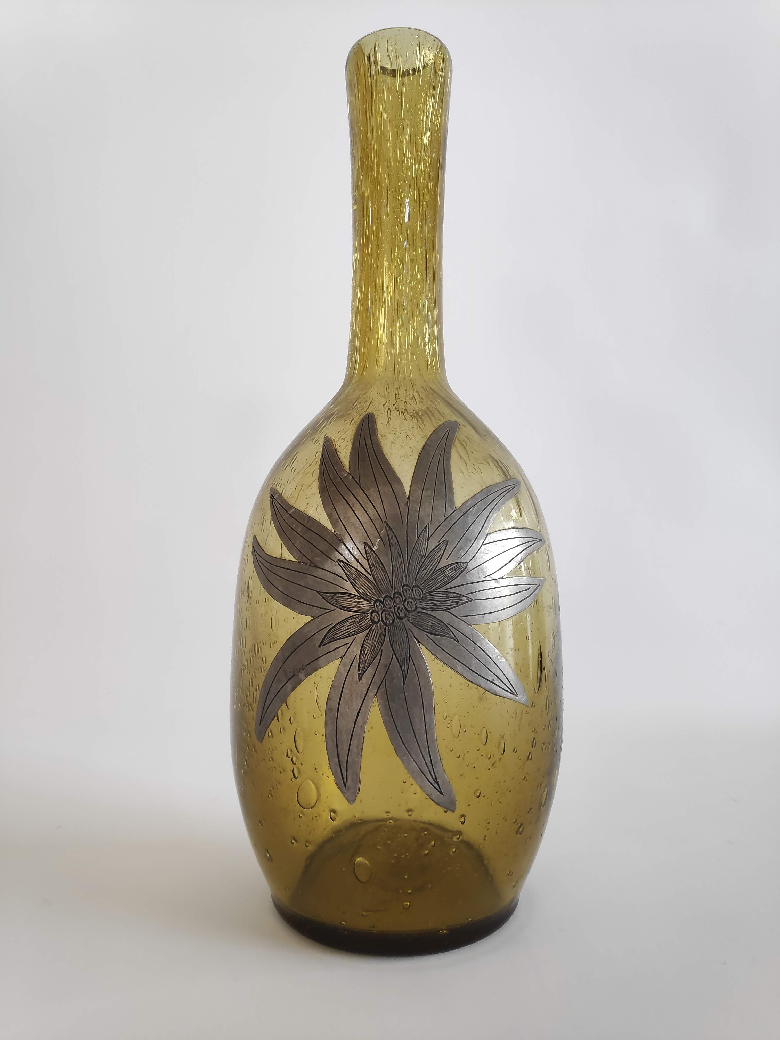 50-year-old soliflora vase in green bulled glass and pewter flower