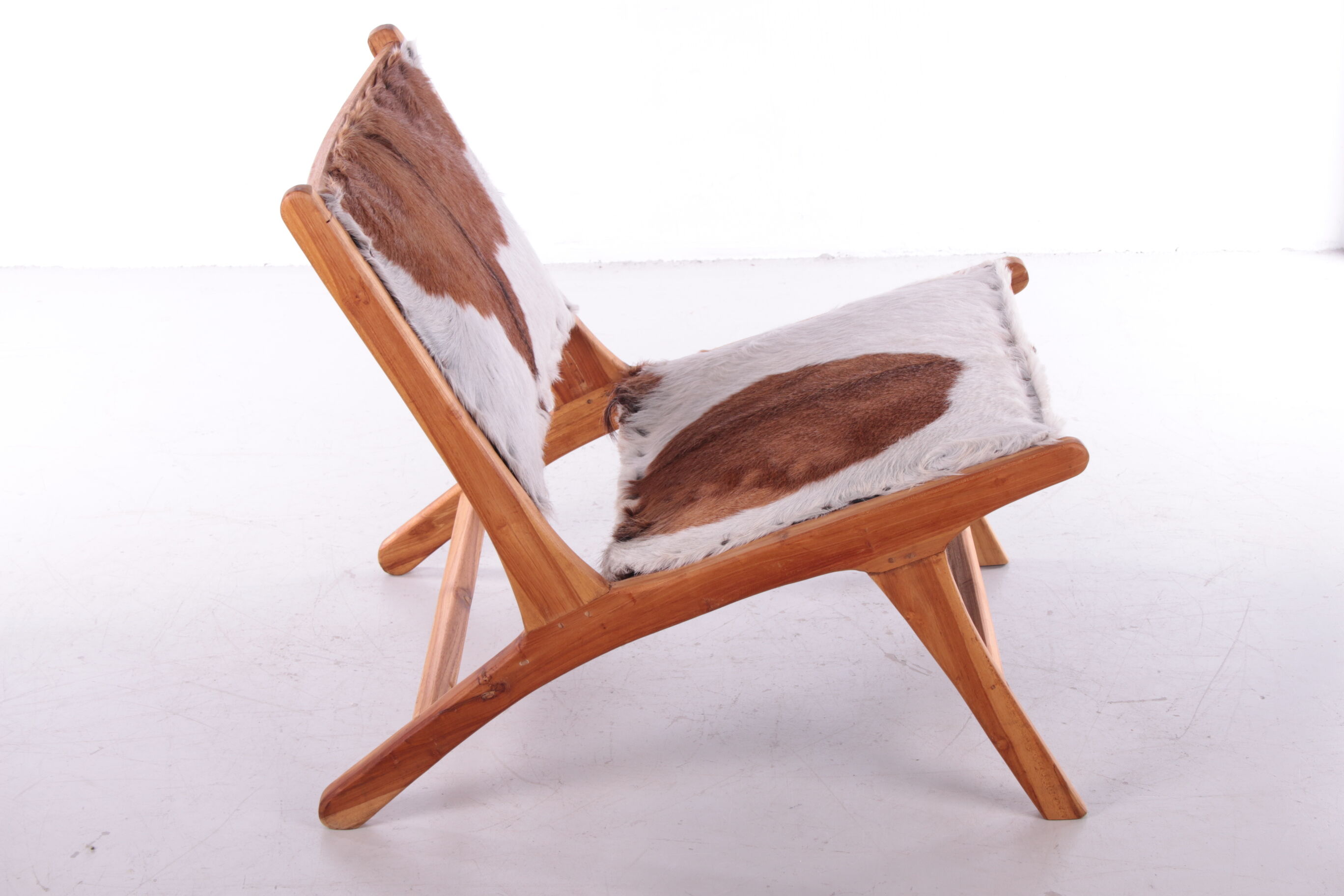 Vintage Relax chair upholstered with cowhide, 1970