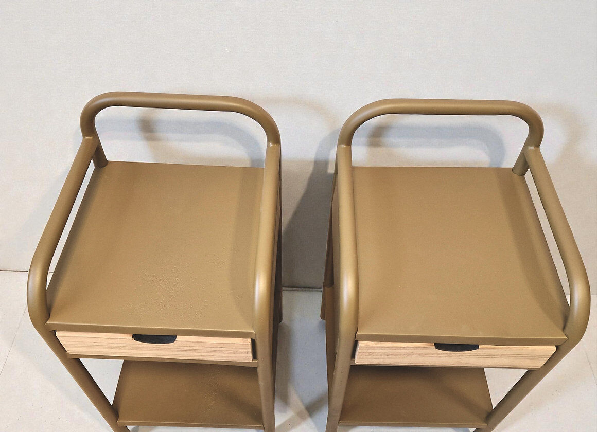 Old ochre metal bedside tables from a boarding school.