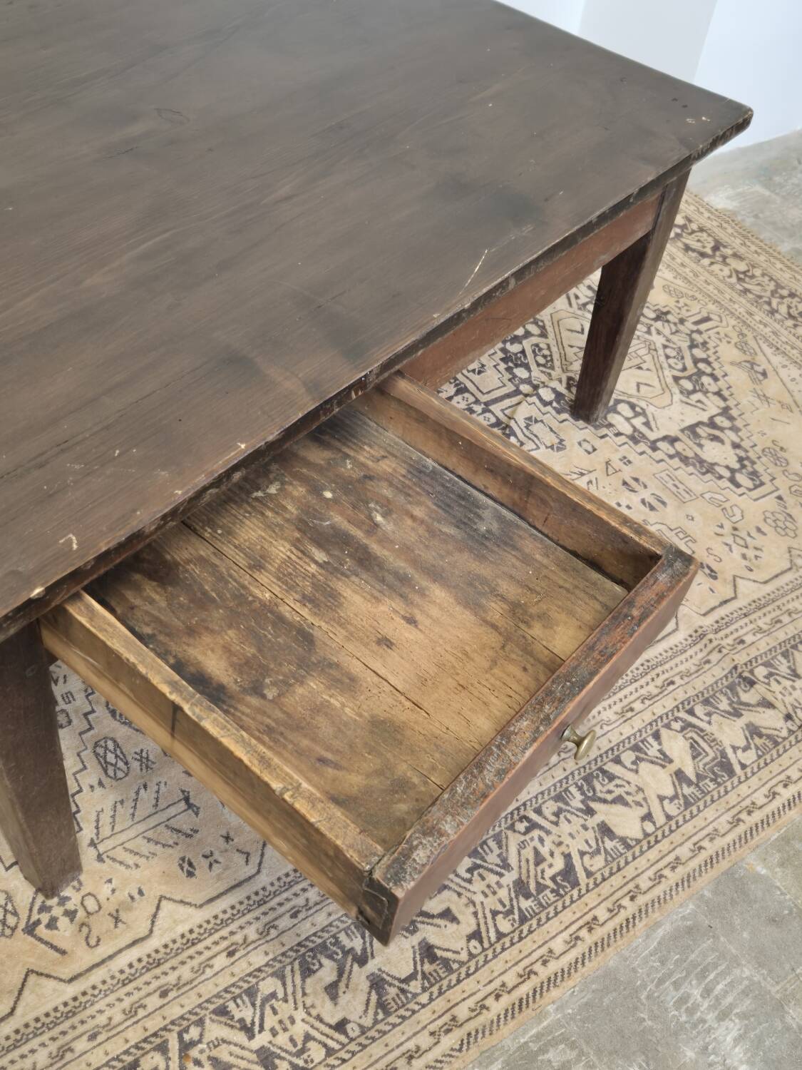 Rustic farmhouse coffee table from the 1900s with two drawers.