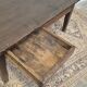 Rustic farmhouse coffee table from the 1900s with two drawers.