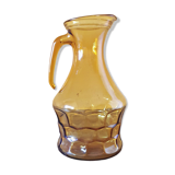 Amber glass pitcher decorated