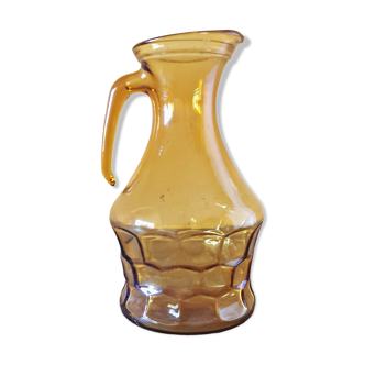 Amber glass pitcher decorated