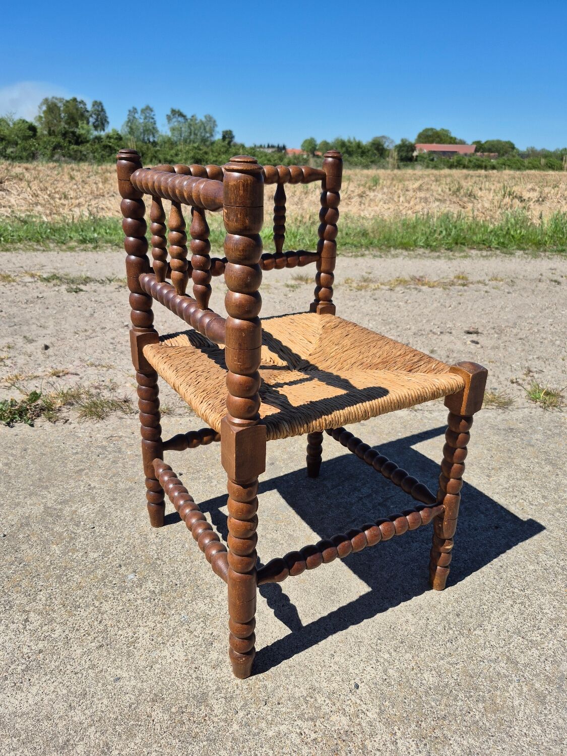 Vintage Dutch rustic corner chair bobbin turned oak with rush seating