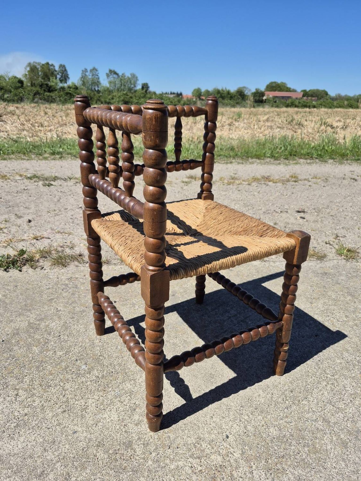 Vintage Dutch rustic corner chair bobbin turned oak with rush seating