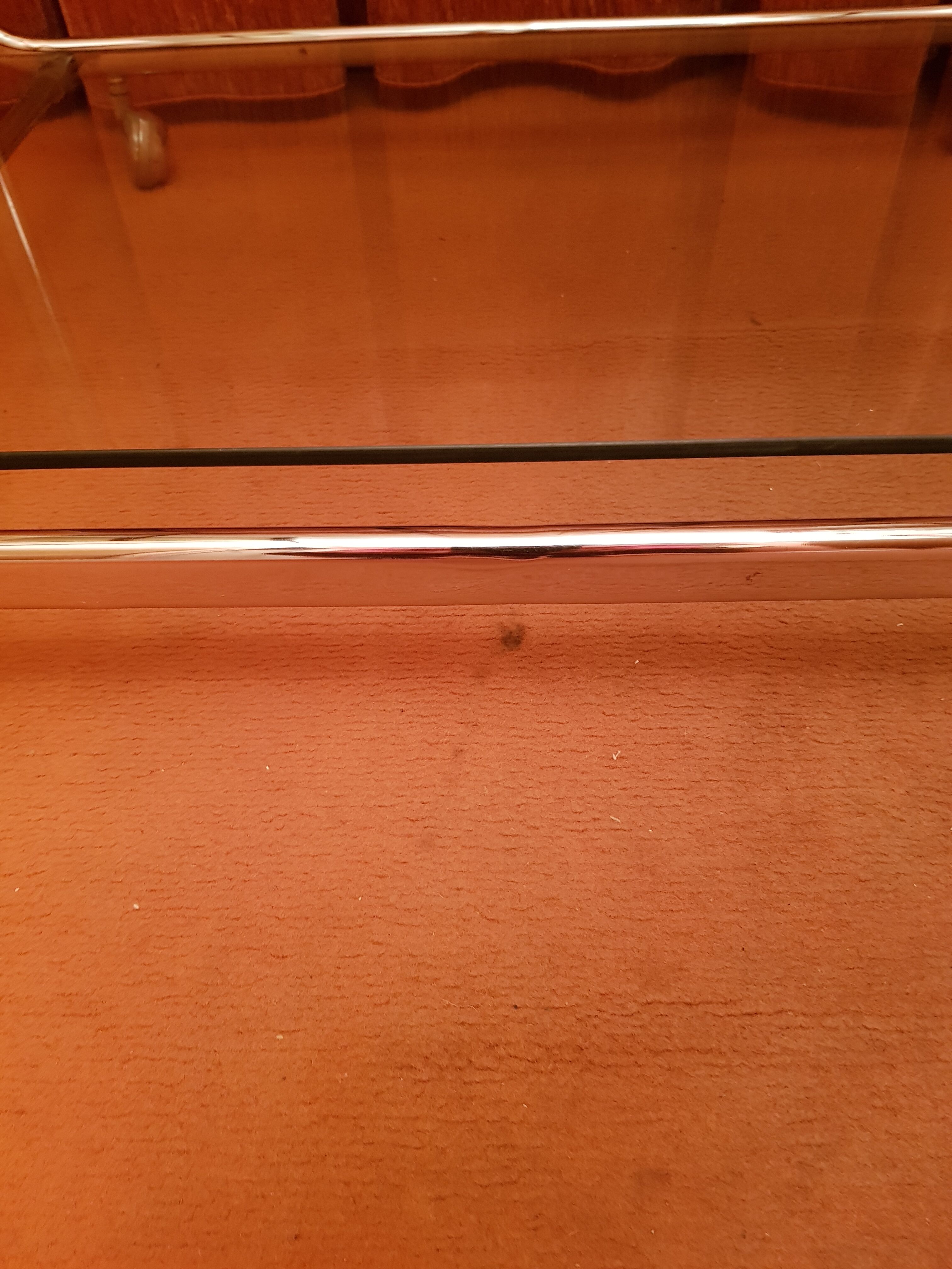 Coffee table with wheels and its two shelves give a smoked