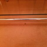 Coffee table with wheels and its two shelves give a smoked