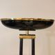 Black lacquered metal floor lamp with brass.