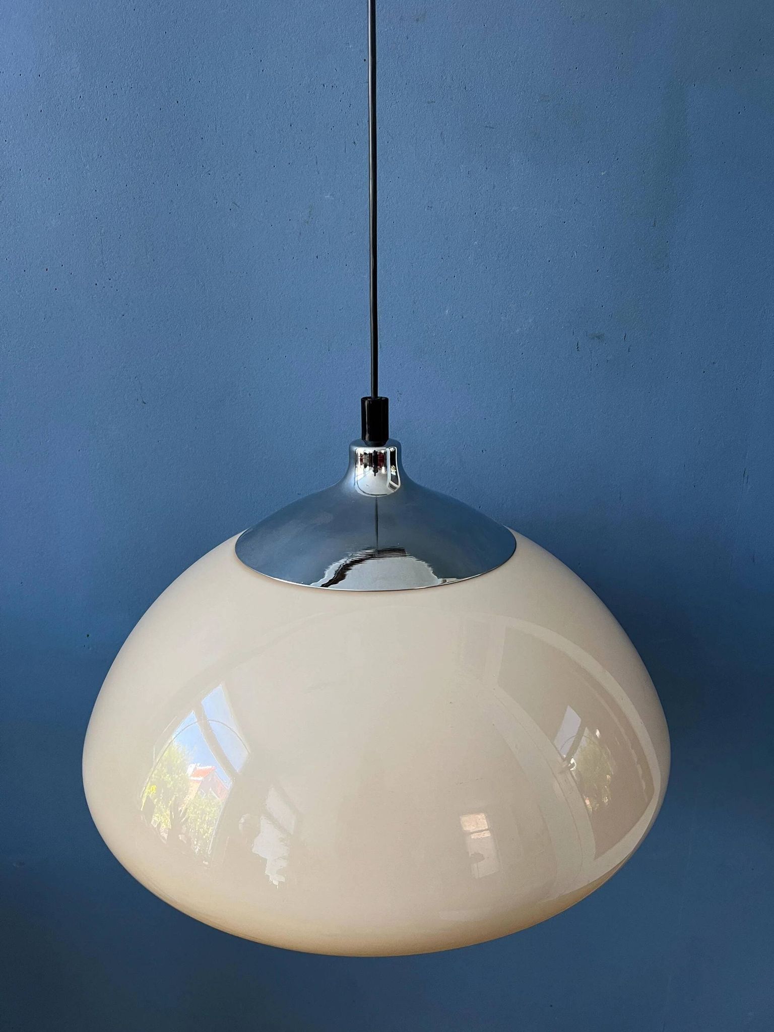 Beige acrylic glass mushroom pendant with a chrome top cap.