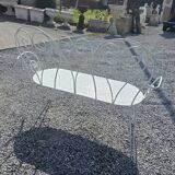 Old garden bench in solid wrought iron