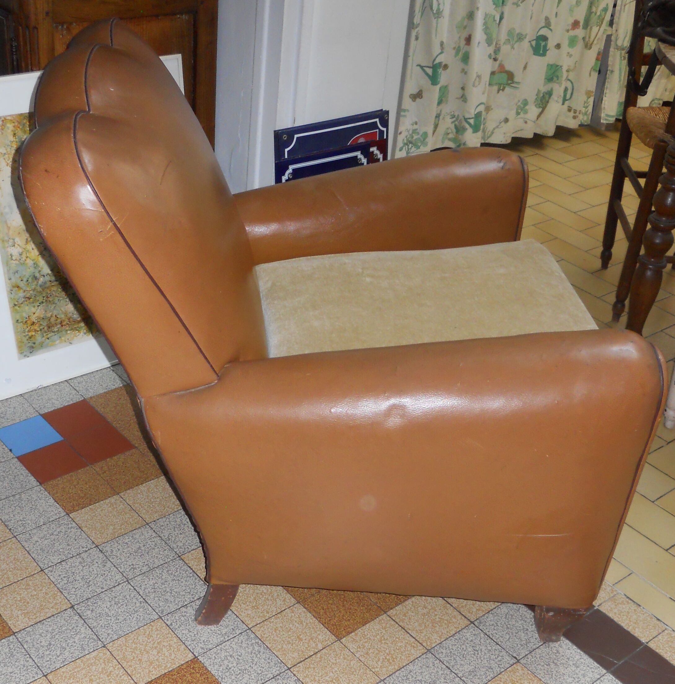 Brown leather club armchair