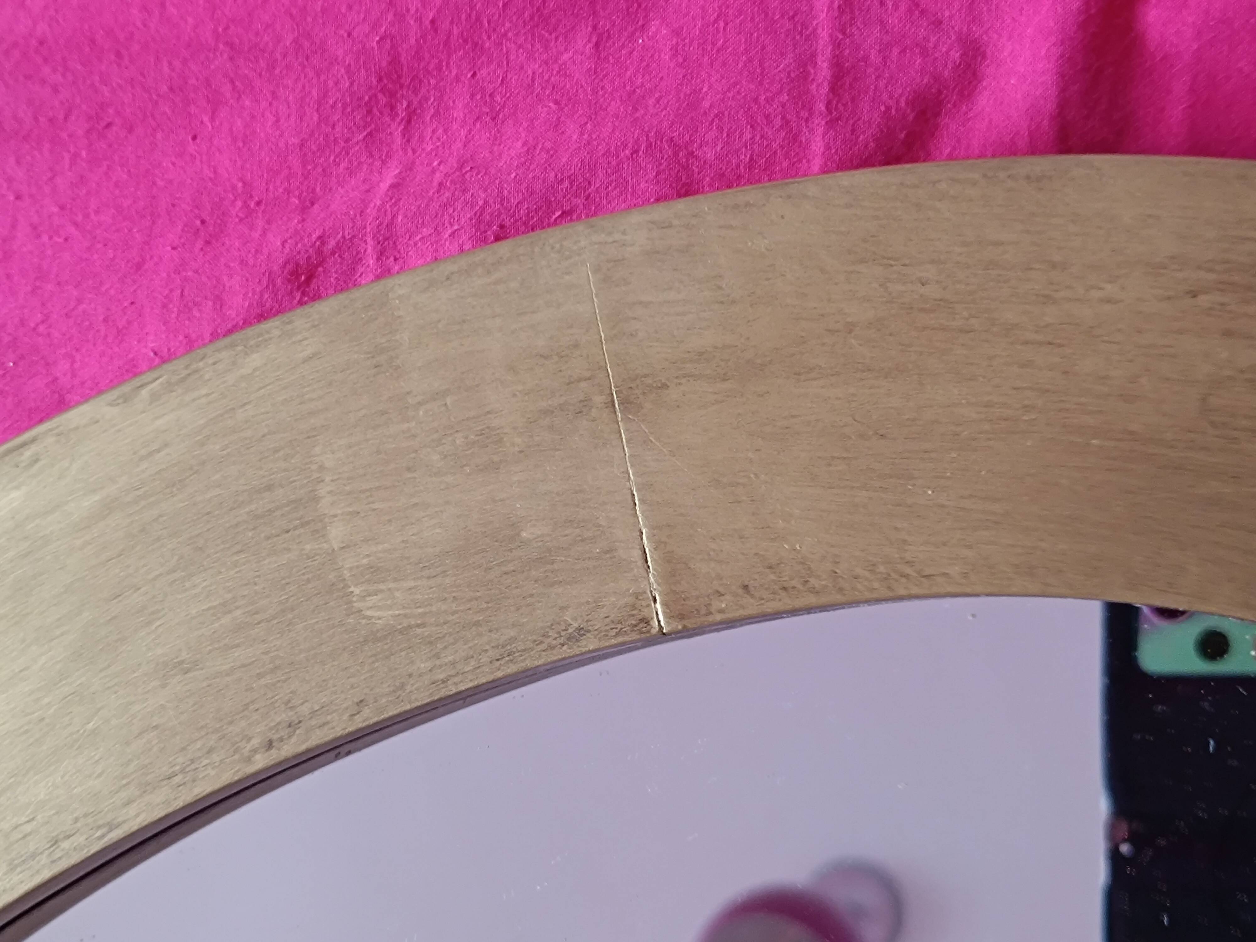 Miroir ovale en bois doré