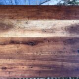 Antique farmhouse table in solid cherry wood with turned legs.