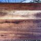 Antique farmhouse table in solid cherry wood with turned legs.
