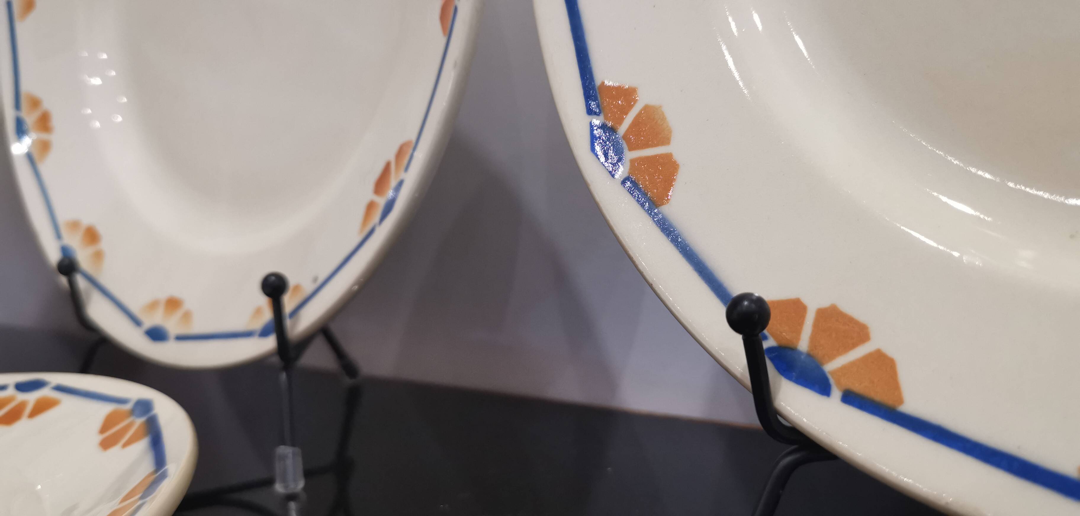 Old semi-deep plates in Terre de fer earthenware
