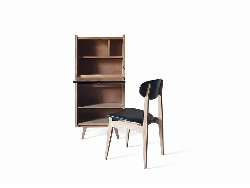 Vintage 1960s secretary desk with an angled design, light wood, and tapered legs.