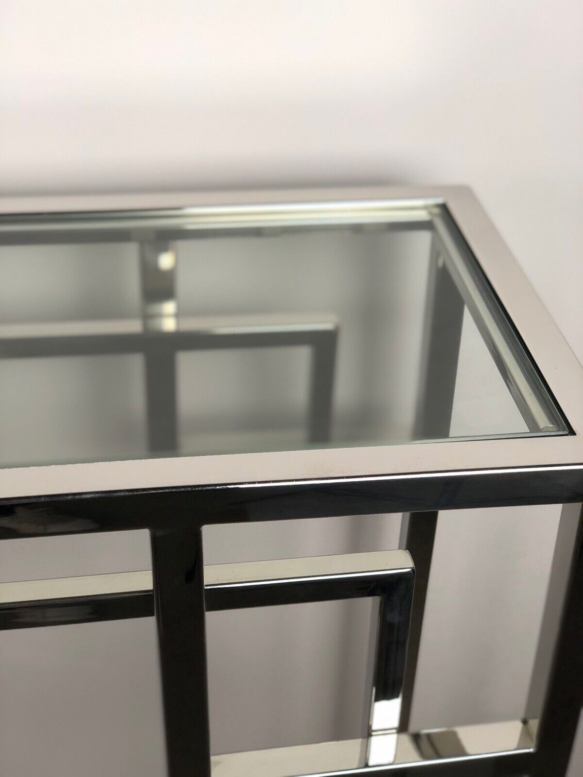 Art Deco style console in chromed metal with glass top