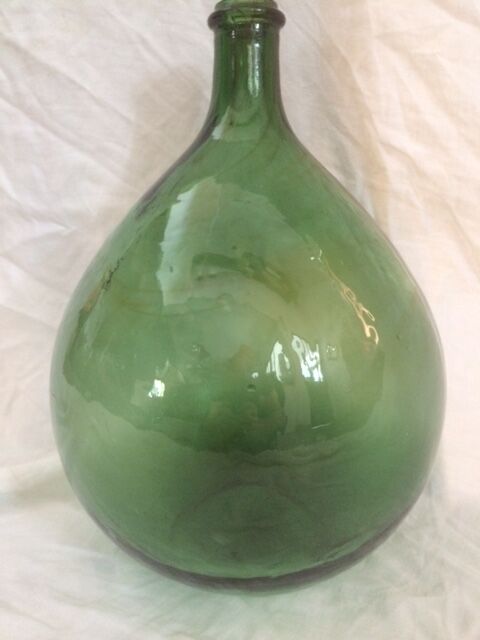 Demijohn with a beautiful glass mixing green and brown
