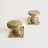 Pair of golden cast iron hooks