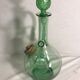 Old refreshing carafe pourer in green blown glass with vintage cap