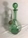 Old refreshing carafe pourer in green blown glass with vintage cap