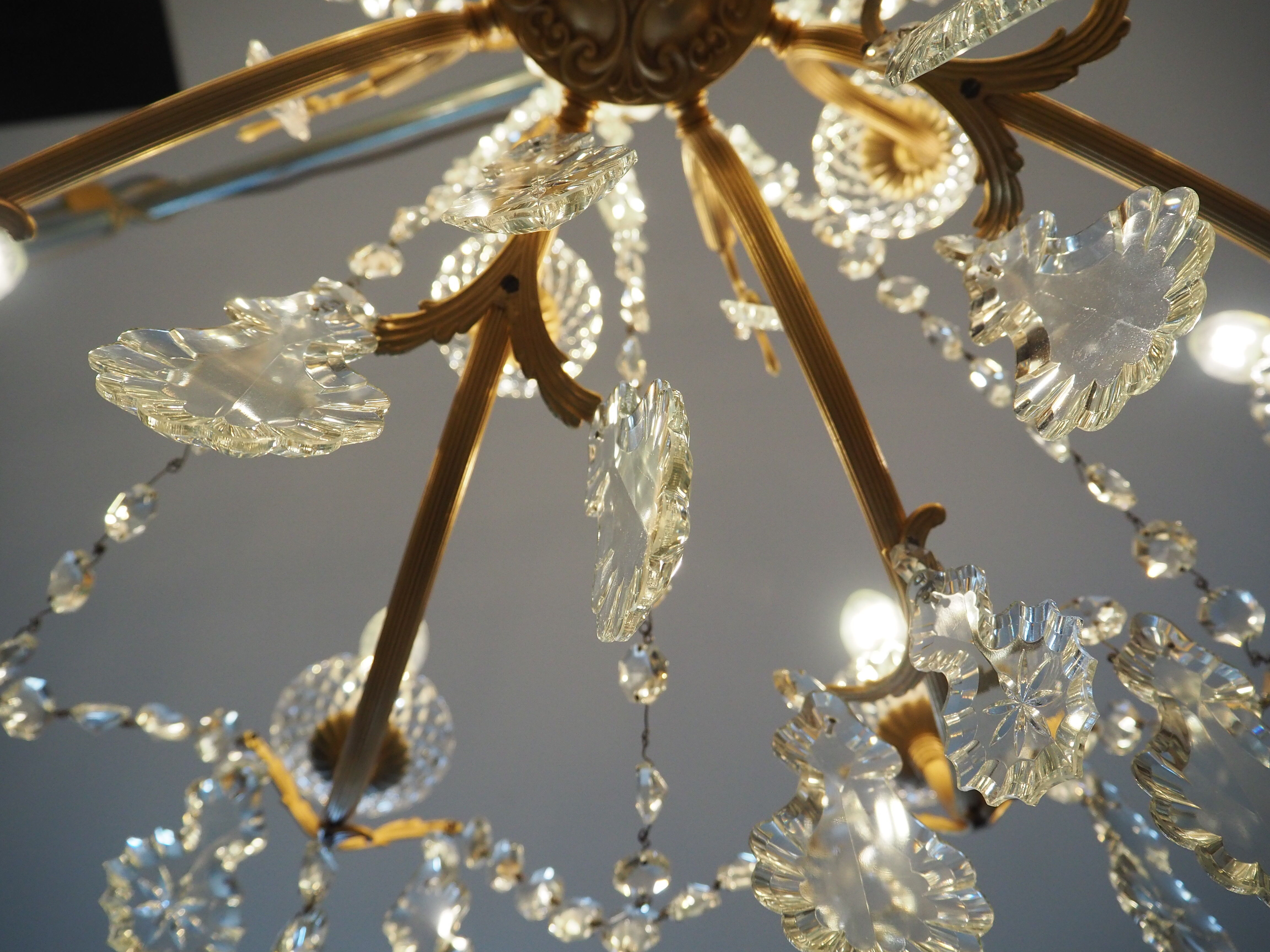 Chandelier 12 lamps with grapevines in crystal, bronze and regulated