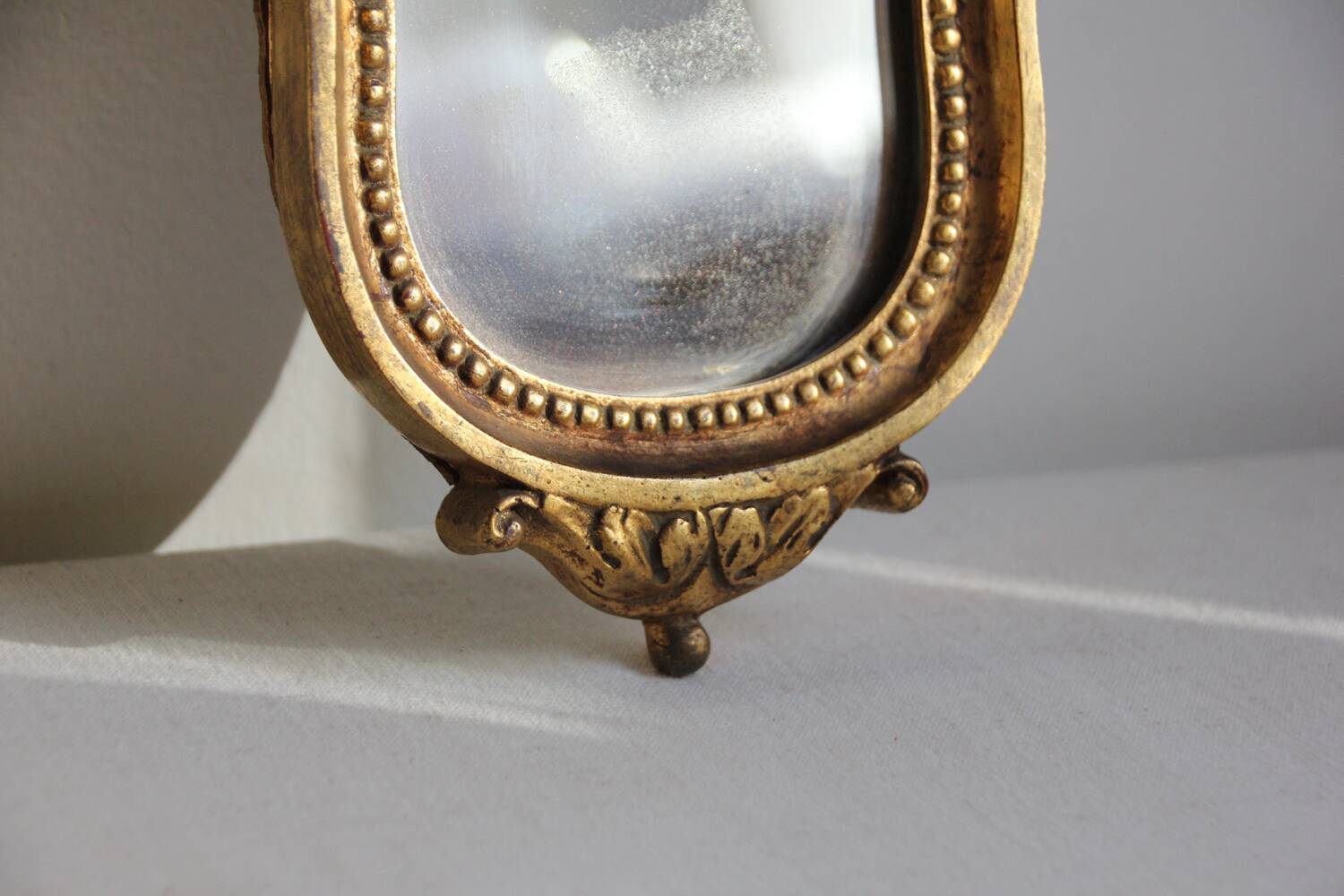 Small golden mirror in baroque style