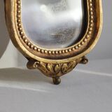 Small golden mirror in baroque style