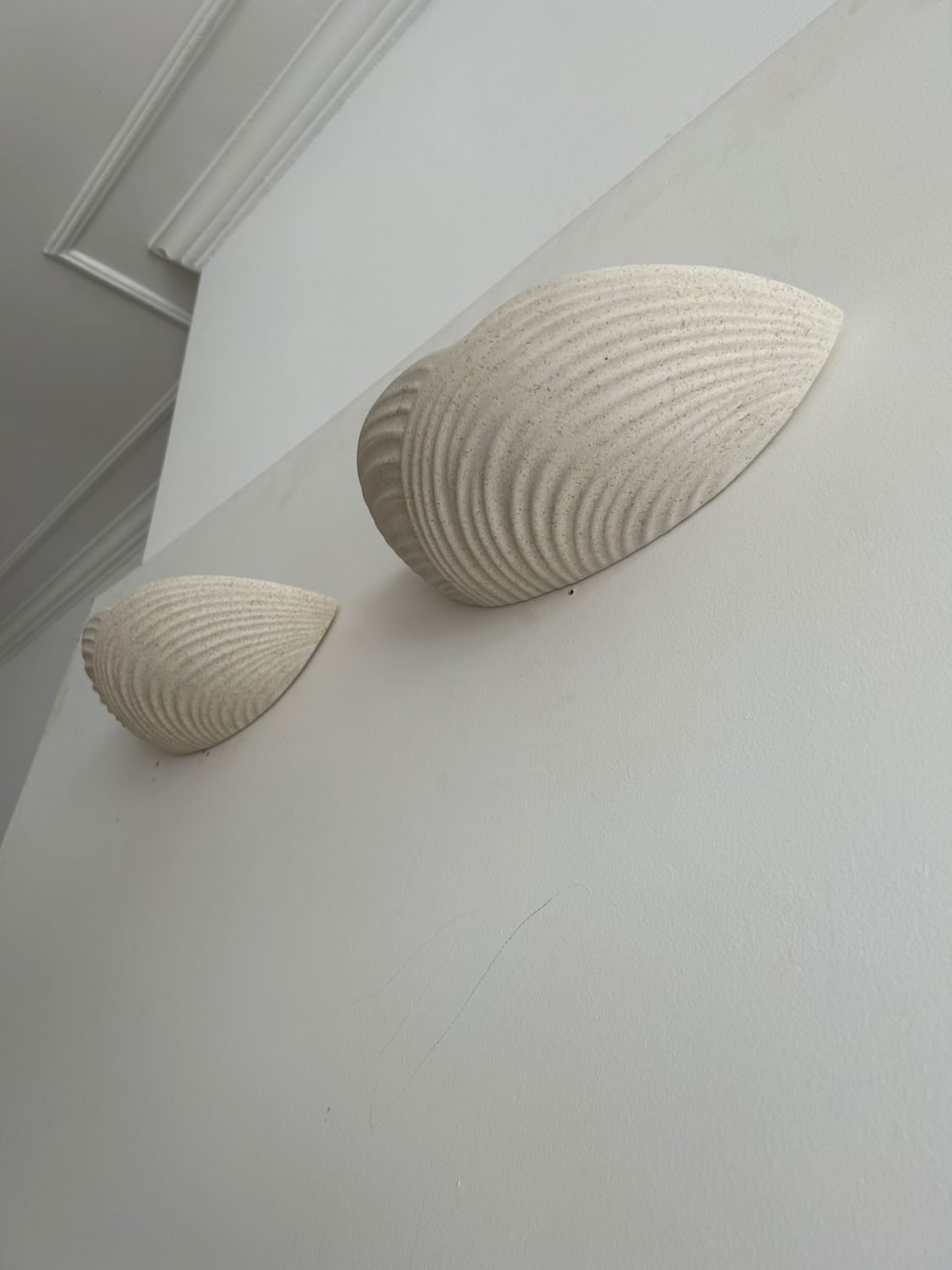 Pair of wall lamps in molded plaster France 1980